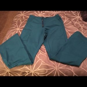 Wonder wink turquoise scrub pants.  Medium tall.